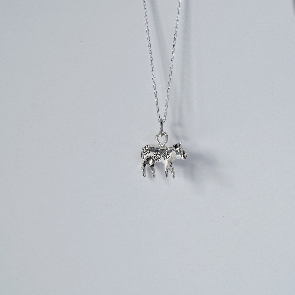 Moo-Moo sterling silver cow necklace worn